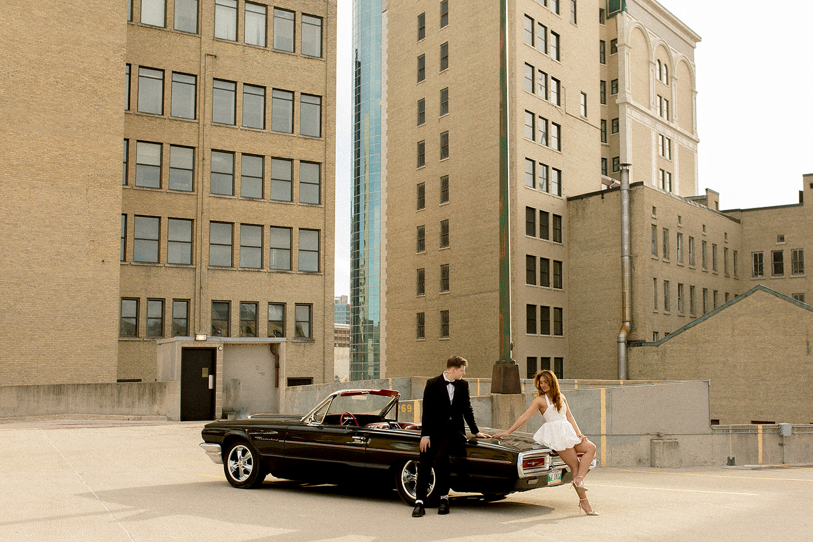 Engagement Photos Downtown Winnipeg Exchange District Vintage Car Couple Rooftop