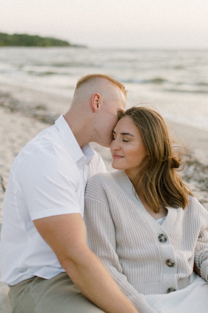 romantic manitoba engagement session of couple on the beach