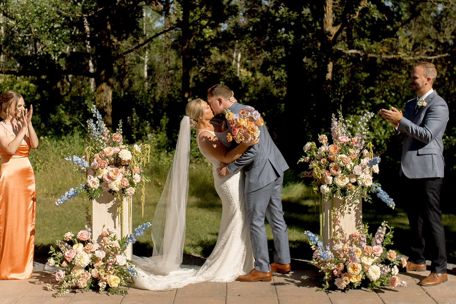colourful wedding summer wedding at the white poplar winnipeg manitoba wedding venue light and airy wedding photographer