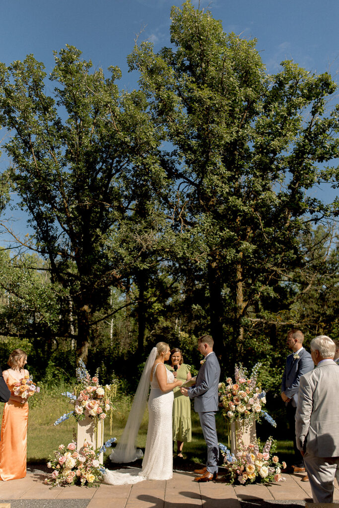 wedding ceremony at the white poplar manitoba wedding venue