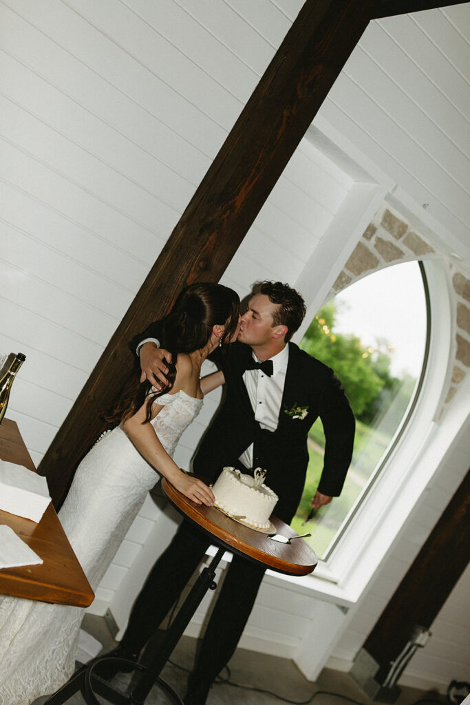 bride and groom cake cutting photos at lilystone gardens, winnipeg wedding photographer